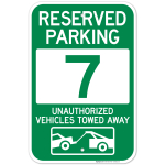 Reserved Parking Number 7, Green Unauthorized Vehicles Towed Away Sign
