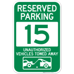 Reserved Parking Number 15, Green Unauthorized Vehicles Towed Away Sign