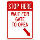 Stop Here Wait For Gate To Open With Right Bottom Arrow Sign