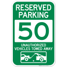 Reserved Parking Number 50, Green Unauthorized Vehicles Towed Away Sign