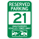 Reserved Parking Number 21, Green Unauthorized Vehicles Towed Away Sign