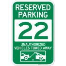 Reserved Parking Number 22, Green Unauthorized Vehicles Towed Away Sign
