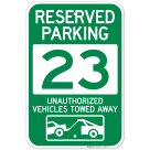Reserved Parking Number 23, Green Unauthorized Vehicles Towed Away Sign