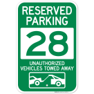Reserved Parking Number 28, Green Unauthorized Vehicles Towed Away Sign