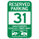 Reserved Parking Number 31, Green Unauthorized Vehicles Towed Away Sign