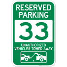 Reserved Parking Number 33, Green Unauthorized Vehicles Towed Away Sign