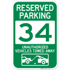 Reserved Parking Number 34, Green Unauthorized Vehicles Towed Away Sign