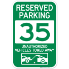 Reserved Parking Number 35, Green Unauthorized Vehicles Towed Away Sign