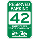 Reserved Parking Number 42, Green Unauthorized Vehicles Towed Away Sign