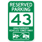 Reserved Parking Number 43, Green Unauthorized Vehicles Towed Away Sign