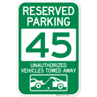 Reserved Parking Number 45, Green Unauthorized Vehicles Towed Away Sign