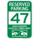 Reserved Parking Number 47, Green Unauthorized Vehicles Towed Away Sign
