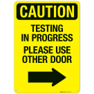 Caution Testing In Progress Please Use Other Door With Right Arrow Sign