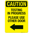 Caution Testing In Progress Please Use Other Door With Left Arrow Sign