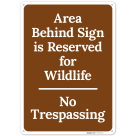Area Behind Sign Is Reserved For Wildlife No Trespassing Sign,